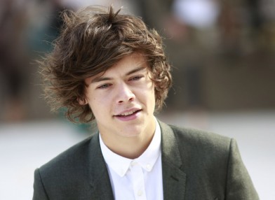 Harry Styles from British pop band One Direction arrives at the Burberry Spring/Summer 2013 collection at London Fashion Week