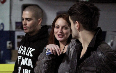 Lindsay Lohan backstage with Max George and Tom Parker at the Boston Jingle Ball gig on Thursday night