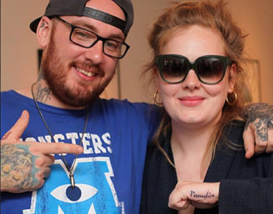 Adele showing off new tattoo with Bang Bang posted on Facebook