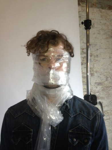 Jay McGuinness cvered in plastic