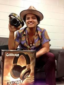 Bruno Mars holding a pair of Razer Kraken E-Panda Hooligan Headphones